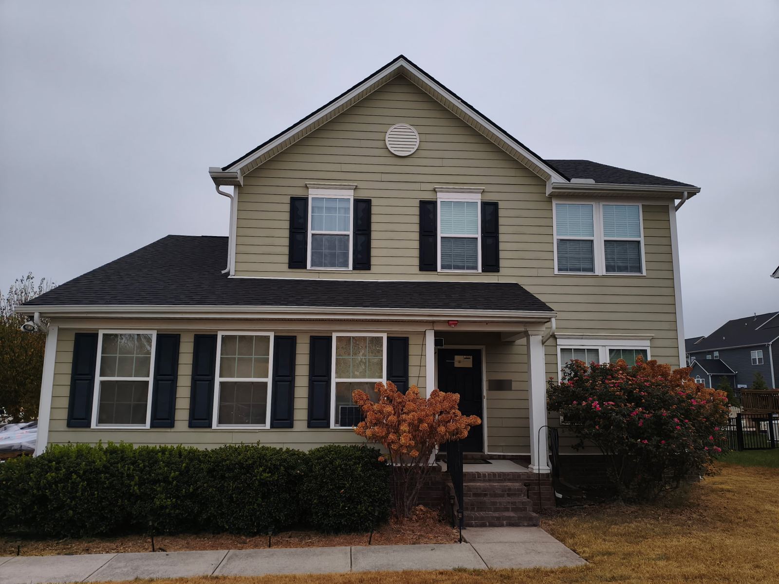 Front of home, roof replacement — before